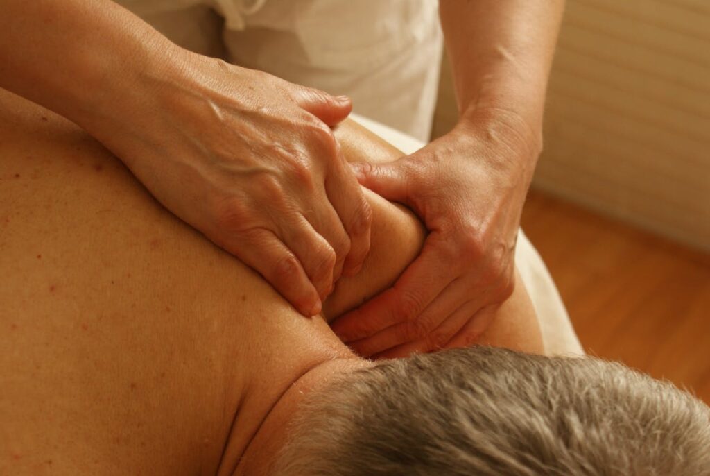 pexels photo 275768 Close-up of a therapist giving a relaxing shoulder massage, enhancing wellness and stress relief.