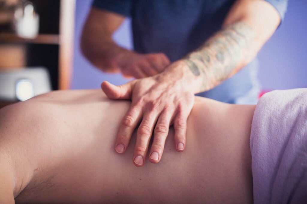 pexels photo 4085450 Close-up of hands performing a soothing back massage in a calming spa environment, promoting relaxation and wellbeing.
